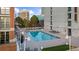 Inviting rooftop pool area, complete with lounge chairs and a surrounding deck at 250 Park W Ave # 701, Atlanta, GA 30313