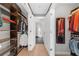 Large walk-in closet with custom shelving and hanging rods at 250 Park W Ave # 701, Atlanta, GA 30313