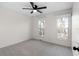 Well-lit bedroom with ceiling fan and plush carpeting at 26 Buena Vista Se Cir, Cartersville, GA 30121