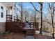 Multi-level deck with wooden railings, steps and surrounding trees at 26 Buena Vista Se Cir, Cartersville, GA 30121