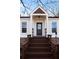 Front entry features brick steps, a dark door, and decorative accents at 26 Buena Vista Se Cir, Cartersville, GA 30121