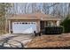 Ranch style home with stone accents and a two-car garage at 4458 English Loop, Lithonia, GA 30038