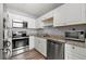 Kitchen with granite countertops and stainless steel appliances at 4458 English Loop, Lithonia, GA 30038