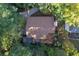 Aerial view of house nestled in a wooded area at 2339 Milstead Cir, Marietta, GA 30066
