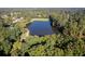 Aerial view of a community lake surrounded by lush trees at 2339 Milstead Cir, Marietta, GA 30066