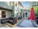Deck with seating area, hot tub, and red umbrella for shade at 2339 Milstead Cir, Marietta, GA 30066