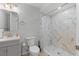 Basement bathroom with gray vanity, marble shower, and neutral tile flooring at 2339 Milstead Cir, Marietta, GA 30066