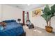 Bedroom with a queen bed, chaise lounge, and large plant at 2339 Milstead Cir, Marietta, GA 30066