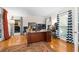 Spacious home office with hardwood floors, large windows, and a large desk at 2339 Milstead Cir, Marietta, GA 30066