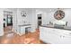 Updated kitchen with white cabinets, granite island, and breakfast bar at 2339 Milstead Cir, Marietta, GA 30066
