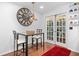 Kitchen breakfast area with glass-top table and French doors at 2339 Milstead Cir, Marietta, GA 30066