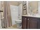 Clean bathroom with a shower/tub combo and dark vanity at 2632 Muskeg Ct, South Fulton, GA 30331