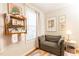 Bright Bedroom featuring a comfortable armchair, a decorative shelf, and whimsical artwork, perfect for a cozy and creative space at 15 Kings Tavern Nw Pl, Atlanta, GA 30318