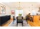 Cozy dining area with stylish lighting fixtures and an open layout to the kitchen at 15 Kings Tavern Nw Pl, Atlanta, GA 30318