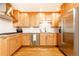 Modern kitchen featuring stainless steel appliances, granite countertops and hardwood floors at 15 Kings Tavern Nw Pl, Atlanta, GA 30318