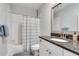 Bathroom with a white shower and vanity with gray countertop at 33 Ponce De Leon Ne Ave # 203, Atlanta, GA 30308