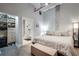 Modern bedroom featuring a comfortable bed, ensuite bath and closet, and industrial style ceiling at 33 Ponce De Leon Ne Ave # 203, Atlanta, GA 30308