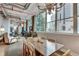 Combined living and dining area features large windows and city views at 33 Ponce De Leon Ne Ave # 203, Atlanta, GA 30308