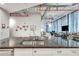 A close up view of a kitchen island with granite countertops and stainless steel appliances and faucet at 33 Ponce De Leon Ne Ave # 203, Atlanta, GA 30308