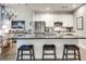 Modern kitchen with stainless appliances, stone counters, breakfast bar and pendant lighting at 33 Ponce De Leon Ne Ave # 203, Atlanta, GA 30308