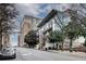 Street view of the building next to the Element Courtyard Hotel on a tree-lined street at 33 Ponce De Leon Ne Ave # 203, Atlanta, GA 30308