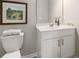 Clean bathroom with white vanity, toilet and framed art at 5591 Hislop Lane # 77, Mableton, GA 30126