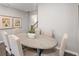 Casual dining area with an oval wooden table and six light beige chairs at 5595 Hislop Ln # 77, Mableton, GA 30126