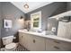 Modern bathroom with a long vanity, stylish mirror, and elegant fixtures at 66 Howell Ne St, Atlanta, GA 30312