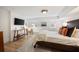 Cozy bedroom with a comfortable bed, modern lamps, and decorative pillows at 66 Howell Ne St, Atlanta, GA 30312