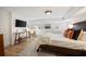 Comfortable bedroom with king-size bed and wood flooring at 66 Howell Ne St, Atlanta, GA 30312