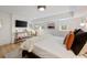 Bright bedroom featuring warm tones, console table, and hardwood floors at 66 Howell Ne St, Atlanta, GA 30312