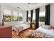 Comfortable bedroom featuring hardwood floors, bright windows, and twin beds at 66 Howell Ne St, Atlanta, GA 30312