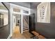 Stylish entryway with stairs leading upstairs, wooden floors, and a mirror at 66 Howell Ne St, Atlanta, GA 30312