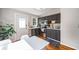 Charming kitchen with gray cabinets, stainless steel appliances, and hardwood floors at 66 Howell Ne St, Atlanta, GA 30312