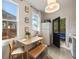 Bright eat-in kitchen area with bench seating and natural light from adjacent screened porch at 66 Howell Ne St, Atlanta, GA 30312
