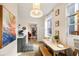 Bright kitchen featuring eat-in area, ample storage, modern light fixture, and view into living space at 66 Howell Ne St, Atlanta, GA 30312