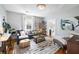 Comfortable living room featuring a sectional sofa, area rug, and natural light at 66 Howell Ne St, Atlanta, GA 30312