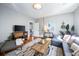 Living room with gray sectional sofa and hardwood floors at 66 Howell Ne St, Atlanta, GA 30312