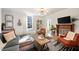 Bright living room with hardwood floors, a modern chandelier, and comfortable furnishings at 66 Howell Ne St, Atlanta, GA 30312