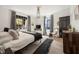 Cozy main bedroom with a window, accent rug, and a comfortable bed at 66 Howell Ne St, Atlanta, GA 30312