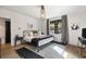 Bright and airy main bedroom featuring a metal bed frame and large window at 66 Howell Ne St, Atlanta, GA 30312