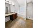 Bathroom with tub, shower, and dark wood vanity at 6921 Foxmoor Way, Douglasville, GA 30134