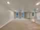 Finished basement with carpeted floors and large windows at 170 Eldorado Dr, Carrollton, GA 30116