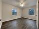 Spacious bedroom with wood-look floors and ceiling fan at 170 Eldorado Dr, Carrollton, GA 30116