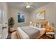 Virtually staged bedroom with a queen-size bed and wood floors at 170 Eldorado Dr, Carrollton, GA 30116