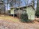 Green house with deck and landscaping at 170 Eldorado Dr, Carrollton, GA 30116