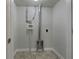 Basement laundry room with hookups and storage at 170 Eldorado Dr, Carrollton, GA 30116