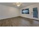 Bright living room with wood-look floors and large window at 170 Eldorado Dr, Carrollton, GA 30116