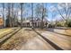 Ranch style home with driveway and mature trees at 203 Savannah Walk, Peachtree City, GA 30269