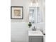 Bathroom features a gray vanity, white tiled walls, and stylish decor at 3448 Montreal Way, Tucker, GA 30084